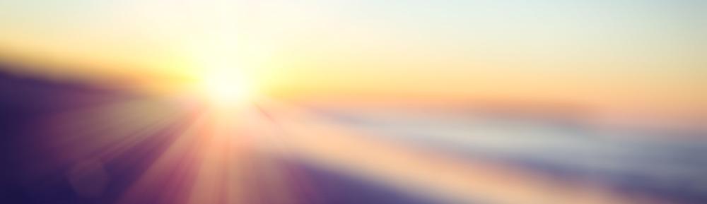sun shining through the horizon