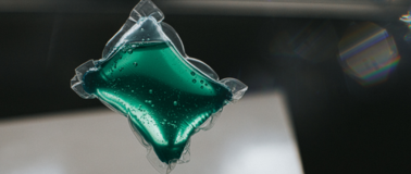 laundry pod filled with green soap