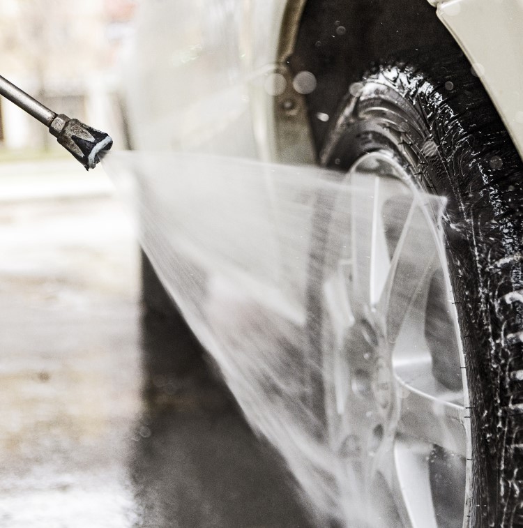 Tire washing chemicals are applied to a vehicle for added shine
