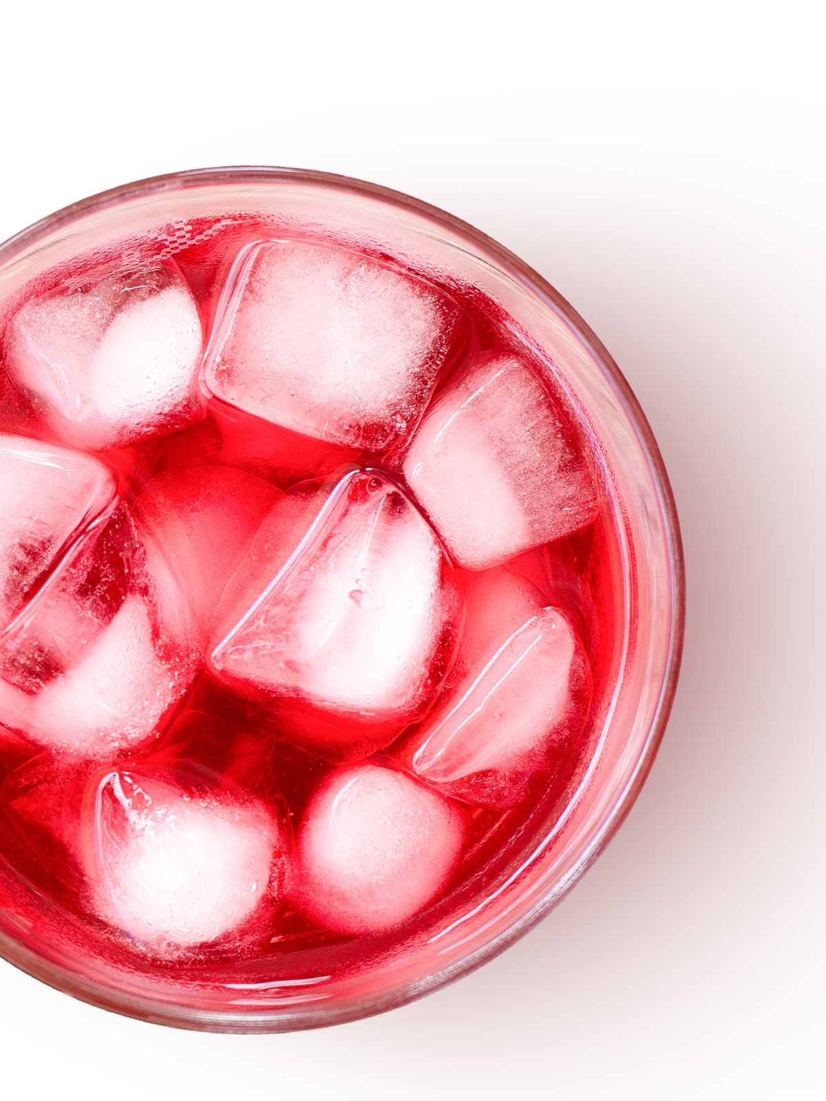 Red beverage in glass with ice