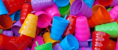 A pile of colurful cups made from plastic additives