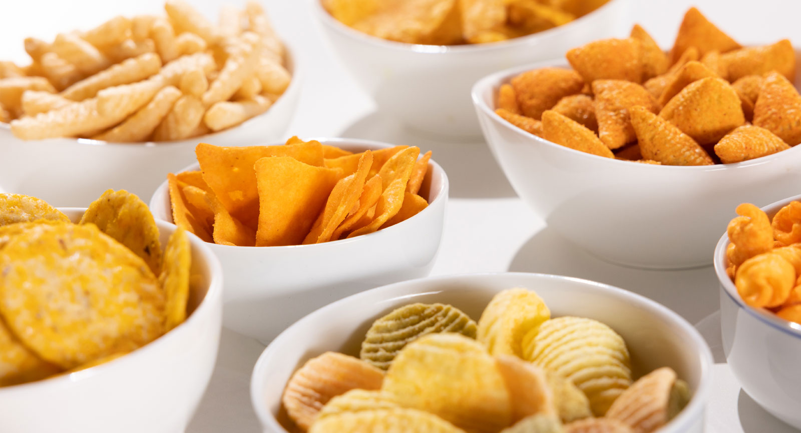 Various delectable snacks that use natural preservatives in white bowls