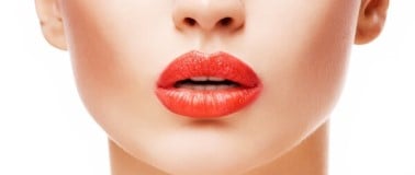 close up of woman wearing lipstick