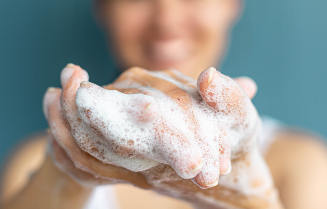 A person washing their hands with a luxirous foam hand wash