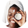 woman applying lotion on her face