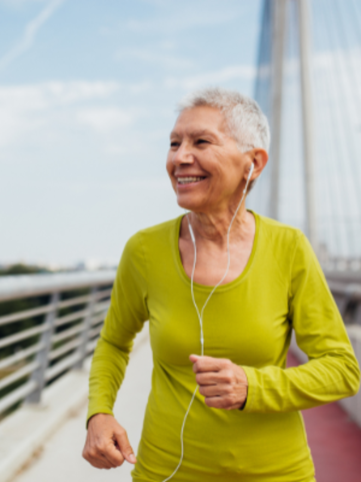elderly woman outide listening to music and running