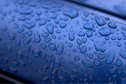 Water droplets on a blue background
