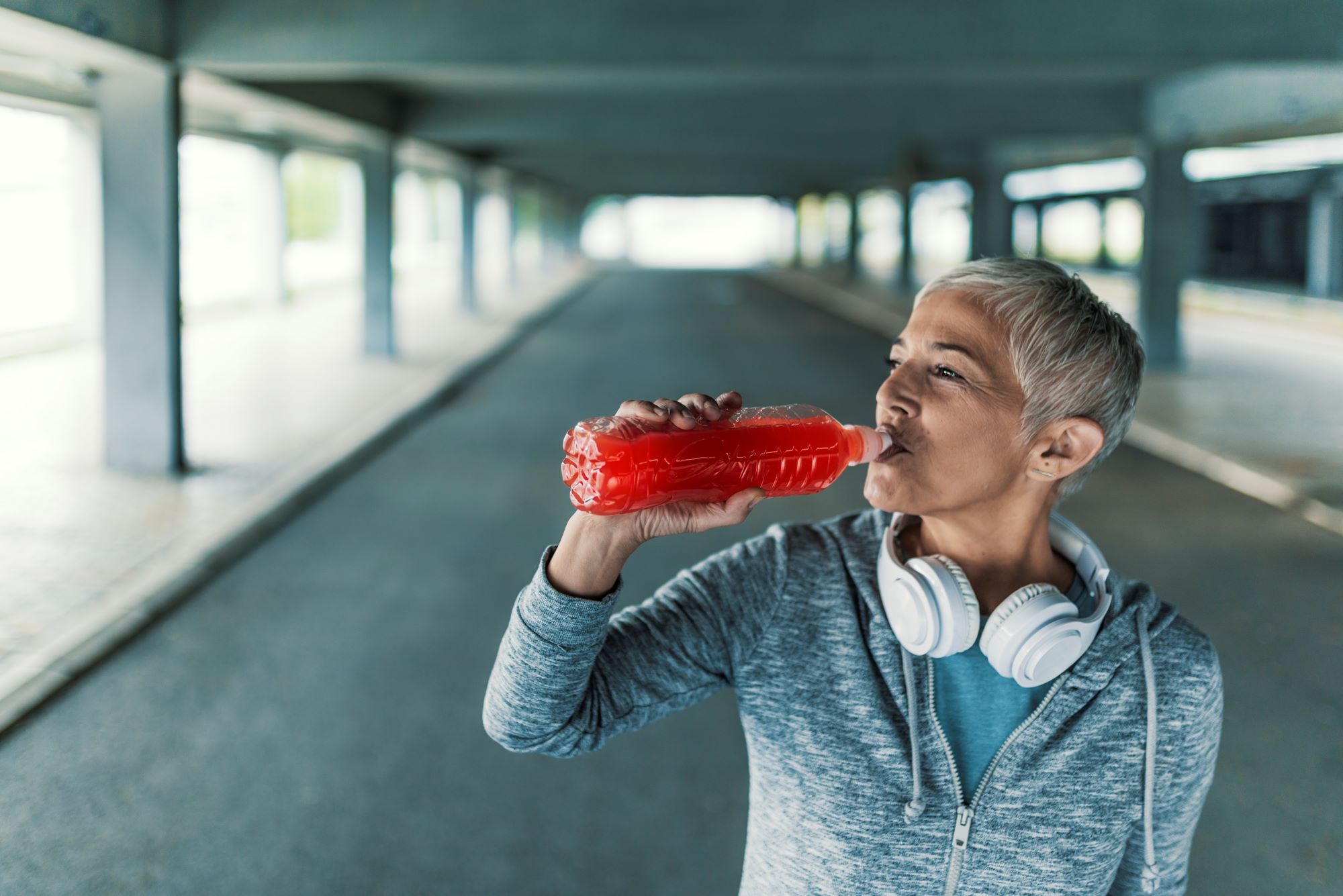 Woman enjoys a post-workout recovery beverage