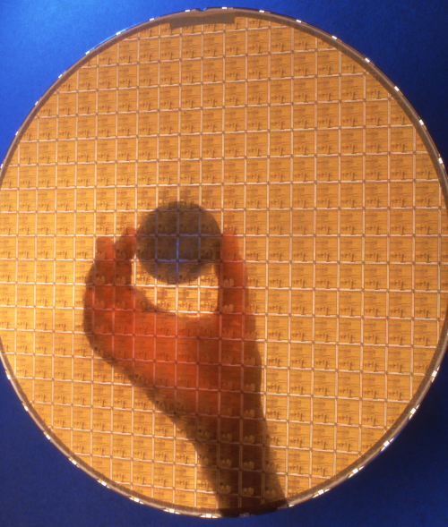 person holding a semiconductor