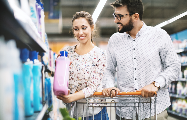 couple in the supermarket looking at skincare products shelf life
