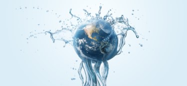 Water splashed earth on a light blue background, depicting a need for water-based sustainable options in rubber adhesives.