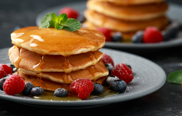 stack of pancakes that is topped with syrup that has made with high frutose corn syrup