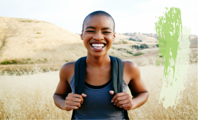 woman hiking and smiling