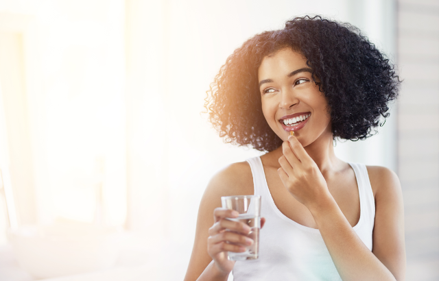 woman taking prescription medication